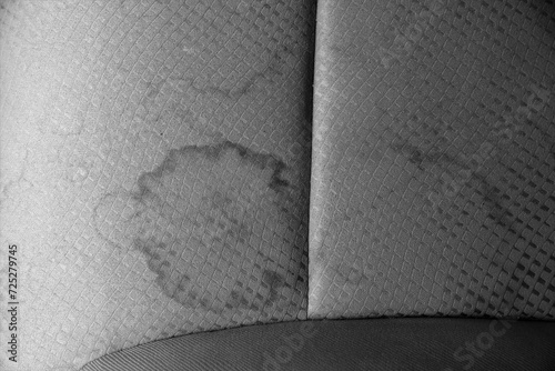 Stain on dirty vehicle seat close up, Black and White background, Car care concept