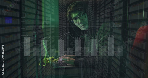 Image of caucasian hacker over data processing on dark background
