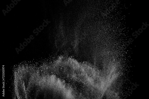 Abstract white dust on black background. Light smoke texture. Powder explosion. Splash water overlay.