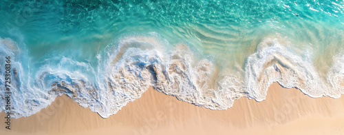 Beautiful tropical beach along the coastline with waves, Aerial drone view of sandy beach.