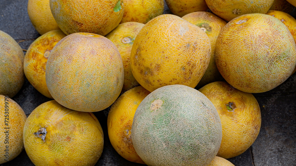 pile of melons, melons that are ripe and ready to eat pile of melons, melons that are ripe and ready to eat