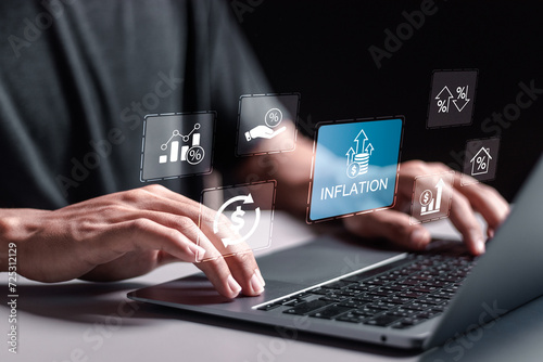 Inflation and tax concept. Person use laptop with virtual inflation rate icon for inflation problem, E-commerce business growth Rising food costs and grocery prices photo