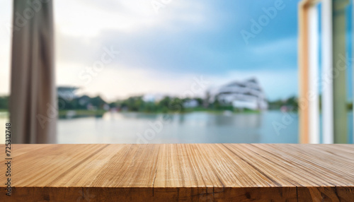 Wooden table top at the blurred background interior. sunway lake view house model