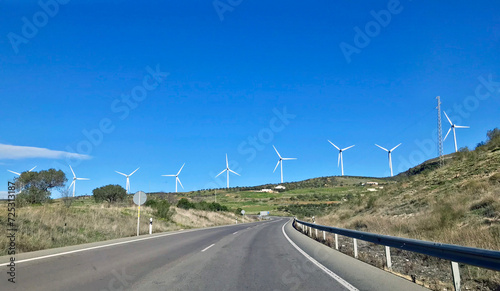 SETENIL DE LAS BODEGAS, SPAIN - JANUARY 25, 2023 - Road with windmills straight ahead