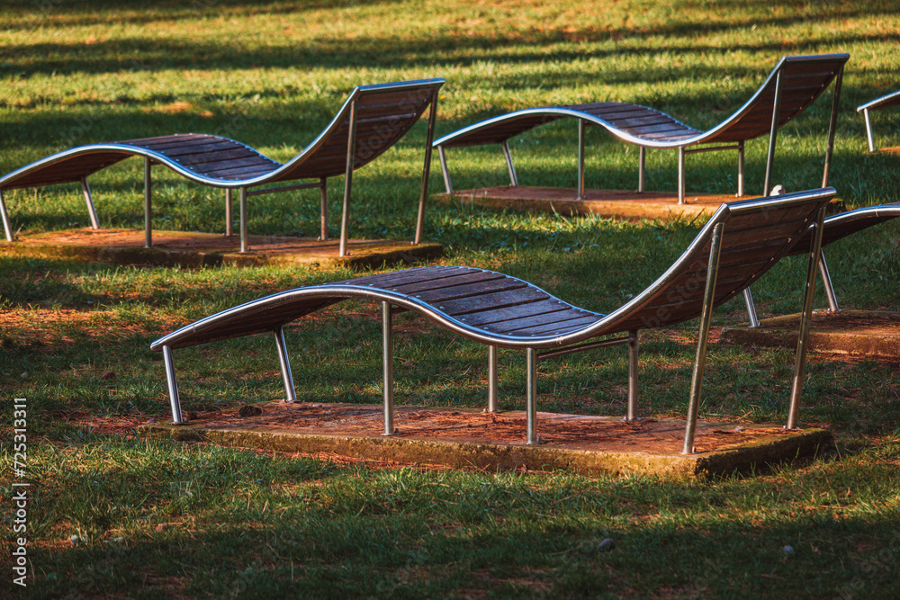 Empty sun loungers in park at sea Empty sun loungers in park at sea