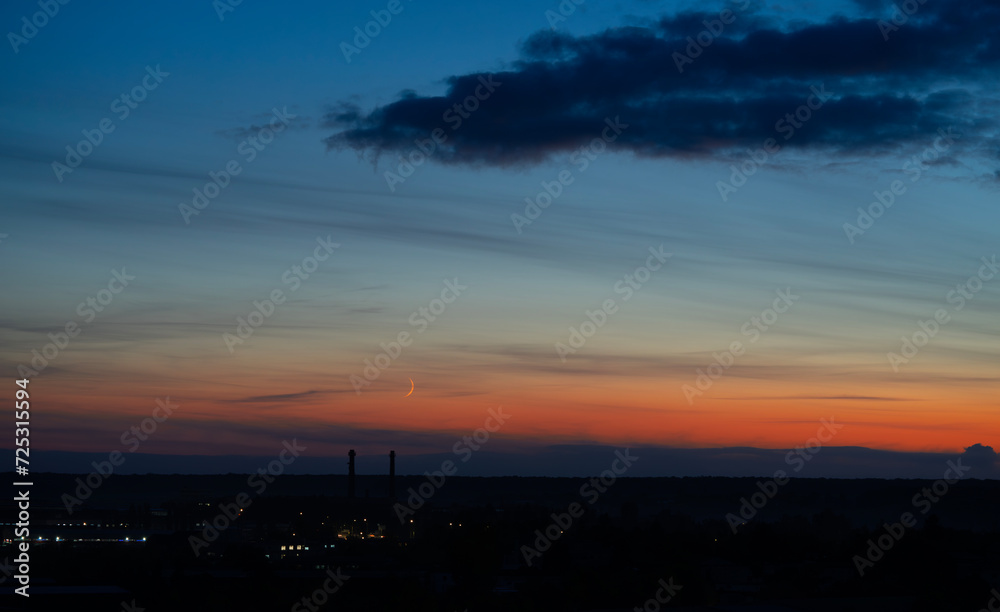 Dramatic dark moody blue and orange sunset sky. Natural background Dramatic dark moody blue and orange sunset sky. Natural background