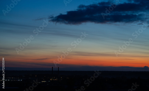 Dramatic dark moody blue and orange sunset sky. Natural background