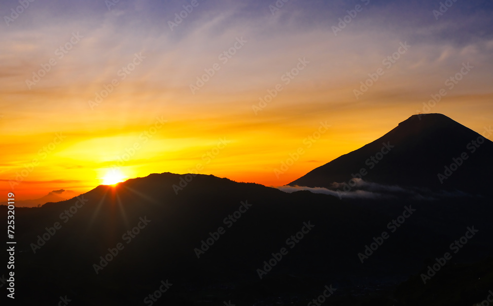 Sunrise with the foreground of Mount Sindoro