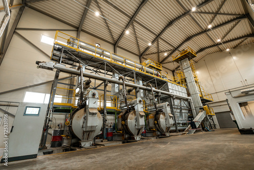 industrial machinery and equipment for the production of eco-friendly wood pellets in a sustainable energy biomass plant, with a focus on environmental technology and renewable resources