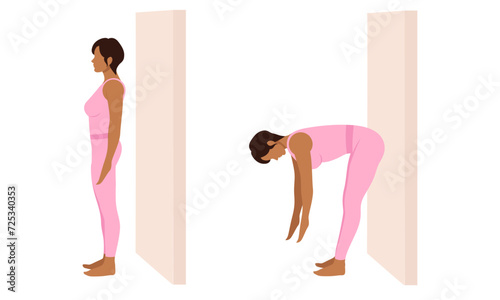 A woman does exercises near the wall. Wall Pilates.