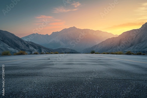 Empty asphalt square and mountain scenery at sunrise