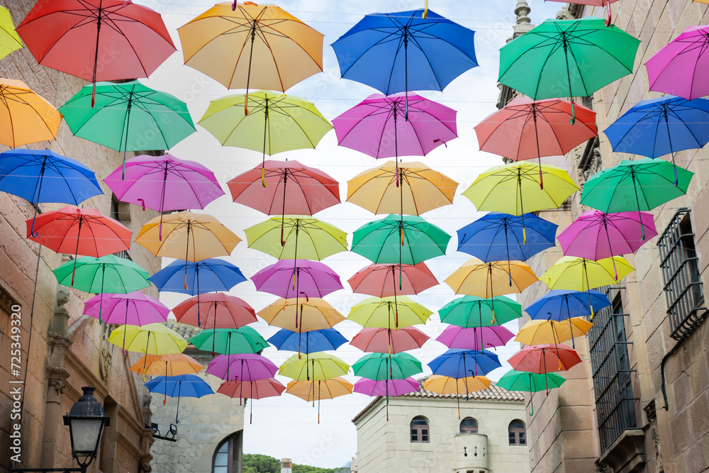 Background of colorful umbrellas decorated on a street 