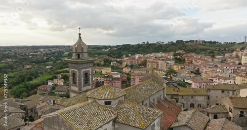 Wallpaper Mural Aerial Majesty: Capturing the Beauty of Bracciano's Cathedral with Bell Tower, Italy - A Historic Cityscape Amidst Mountains and Lakes. High quality 4k footage Torontodigital.ca