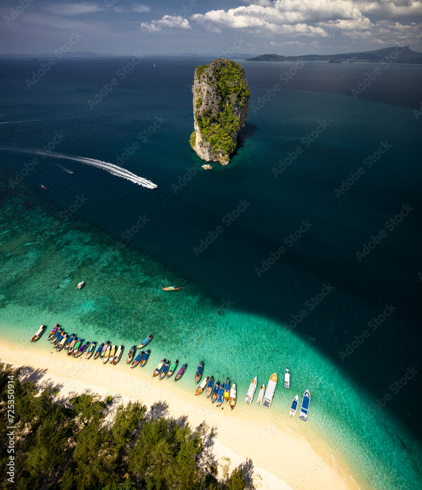 A breathtaking aerial view captures the pristine beauty of Krabi's enchanting island, adorned with turquoise waters and lush greenery