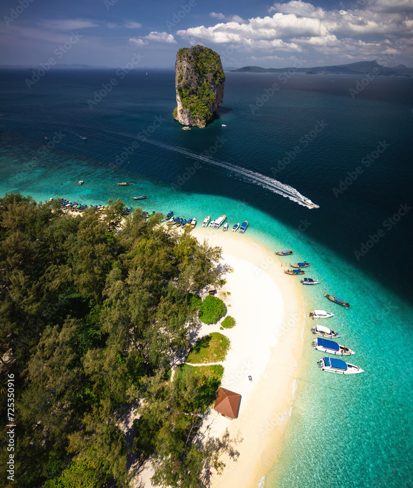 A breathtaking aerial view captures the pristine beauty of Krabi's enchanting island, adorned with turquoise waters and lush greenery