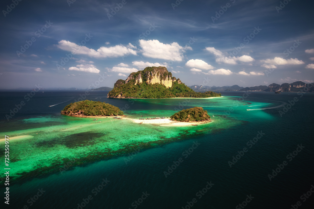 A breathtaking aerial view captures the pristine beauty of Krabi's enchanting island, adorned with turquoise waters and lush greenery