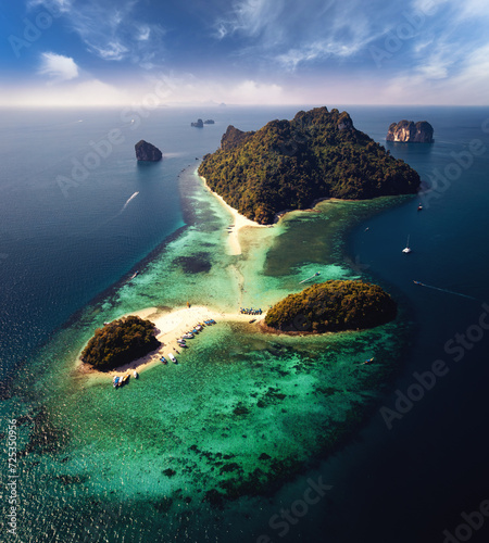 A breathtaking aerial view captures the pristine beauty of Krabi's enchanting island, adorned with turquoise waters and lush greenery