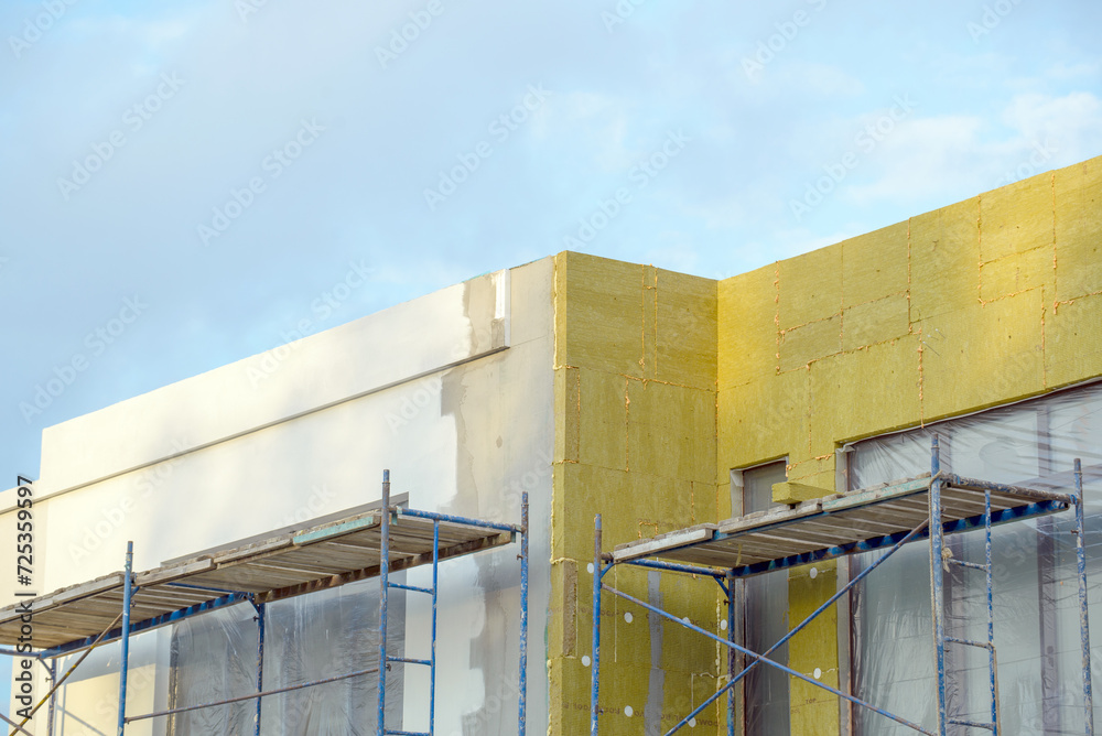 External wall insulation. Energy efficiency house wall renovation for