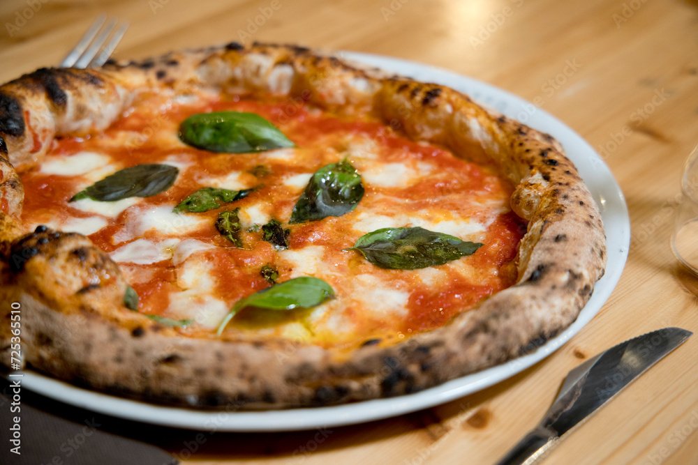 Experience street food by tasting freshly baked pizza made in Naples in multiple flavors and various types