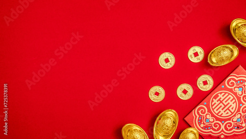 red envelope, ang pow, red packet with ancient Chinese ingot gold bar, Golden Chinese Ancient Feng Shui Lucky Coin for Wealth Money. Chinese Lunar New Year celebration background with copy space