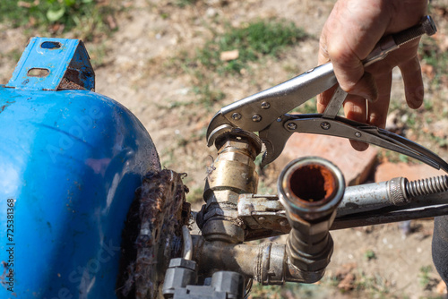 Tableau sur toile Dismantling the water distribution unit of the hydraulic tank of the water station for repair