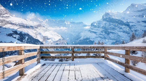 A view from a deck captures a snowy mountain range, showcasing a beautiful snowy landscape and a snowy mountain background.