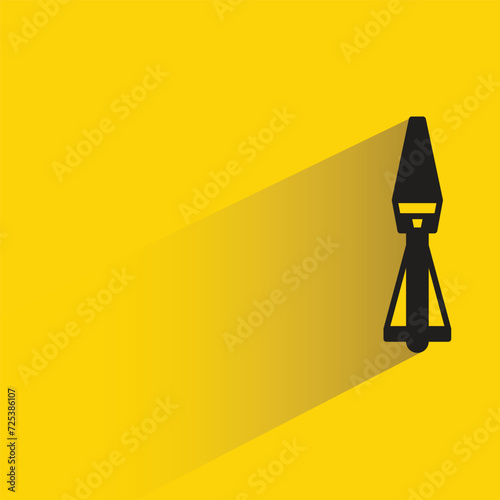 missile icon with shadow on yellow background