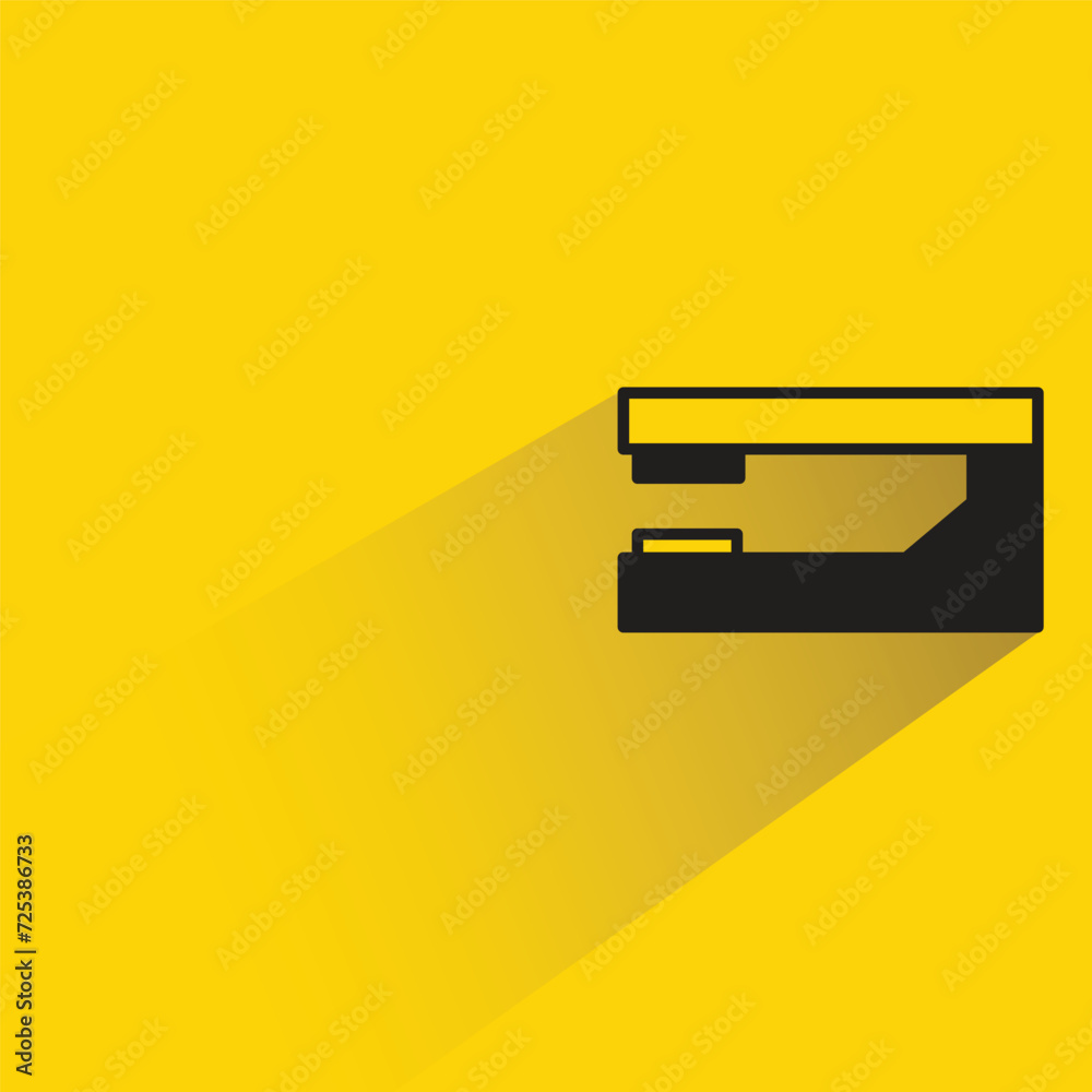 stapler icon with shadow on yellow background stapler icon with shadow on yellow background