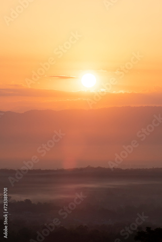 Fototapeta Naklejka Na Ścianę i Meble -  Beautiful morning scenery with Misty Mountain Morning Landscape with Fog and a Beautiful Sunrise Overlooking Hills, Valleys, and a Tranquil Lake, environmental themes