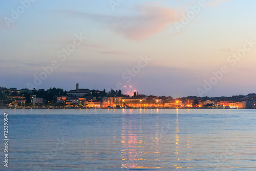The old town of Rovinj with the church of St. Euphemia seen from the sea on a sunny day with blue sky