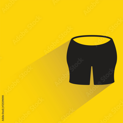 short pant icon with shadow on yellow background