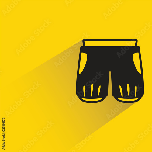 short pant icon with shadow on yellow background