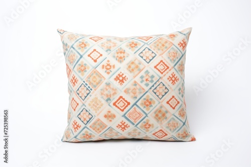 isolated geometrically patterned cushion on white background photo