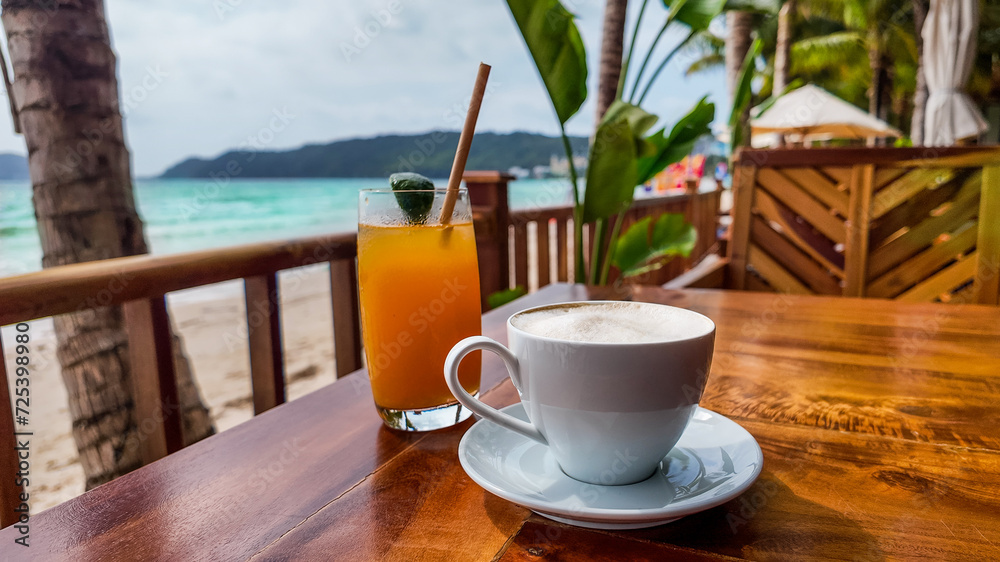 A refreshing glass of juice and a cup of coffee on a wooden table with a tropical beach backdrop, conveying a relaxed vacation atmosphere