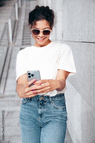 Bild auf Leinwand Young beautiful smiling hipster woman in trendy summer casual clothes
