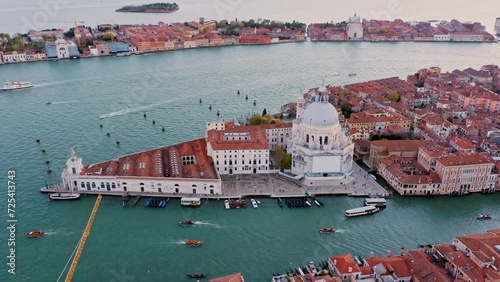 Crane shot, aerial view of Punta della Dogana and Salute church with Grand Canal, Venice, Italy photo