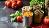 Different kinds of vegetables in cans on kitchen table background.