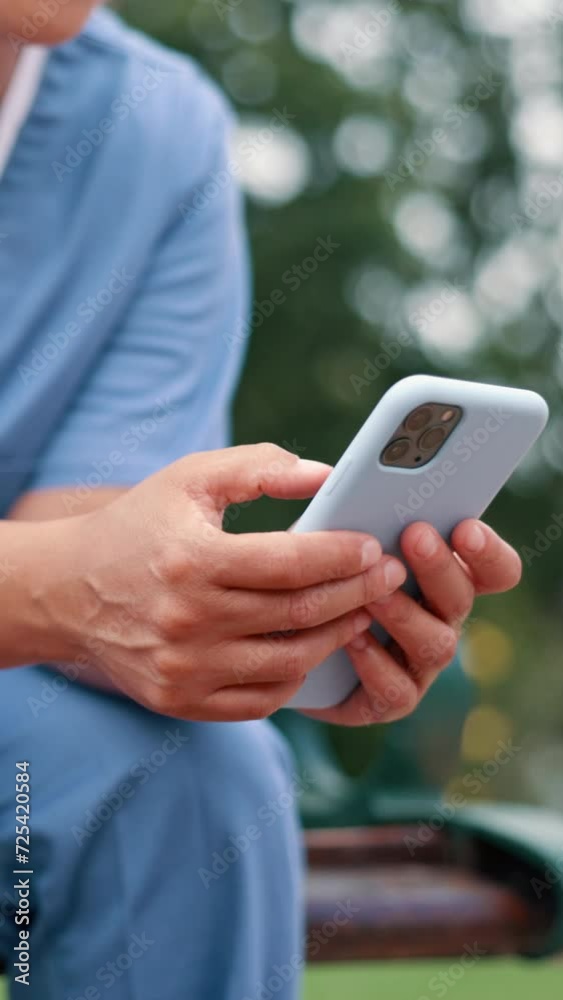 Hands, phone and nurse typing for healthcare service, telehealth or reading email. Smartphone, closeup and medical professional on internet, person and check mobile app for wellness outdoor at park Hands, phone and nurse typing for healthcare service, telehealth or reading email. Smartphone, closeup and medical professional on internet, person and check mobile app for wellness outdoor at park