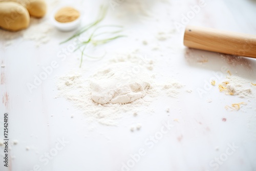gluten-free dough rolled out on a floured surface