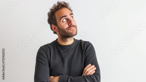 Portrait of a concentrated man looking up, AI-generated.