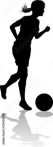 A female soccer football player woman in silhouettes