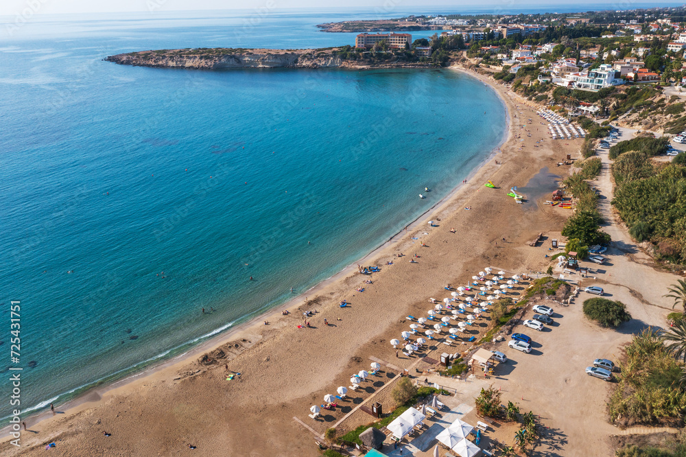 Expansive aerial view of Cyprus sandy beach and azure ocean water, natural beauty of coastline and vastness of sea. Summer travel and mediterranean resorts.