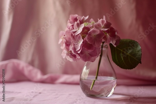 a vase with pink flowers photo