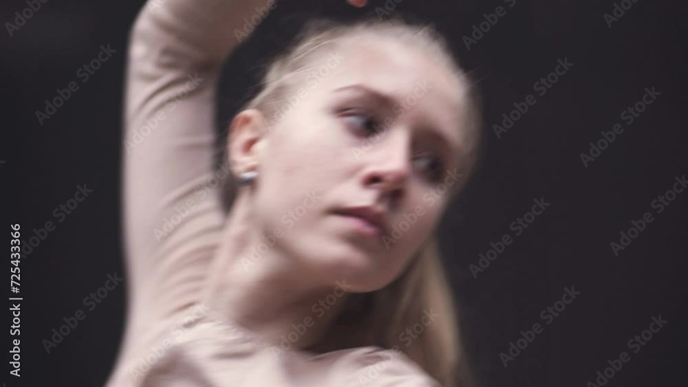 Handheld, young woman dance in a mirror room, flexible girl performs a stretching dance, soft focus. Handheld, young woman dance in a mirror room, flexible girl performs a stretching dance, soft focus.