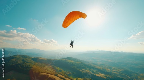 Paragliding Adventure High Above Scenic Mountain Landscape.