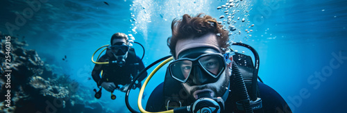 Scuba diving, underwater or diver swimming and exploring for marine adventure, hobby or vacation activity. Beautiful, blue and clear calm ocean view for travel, exploration or environmental discovery photo