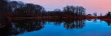 Greenwich Point Park Nature Preserve Seascape at the seafront trails and sandy stretch woodlands with water reflections and pink sky at sunrise in Old Greenwich, Connecticut, USA