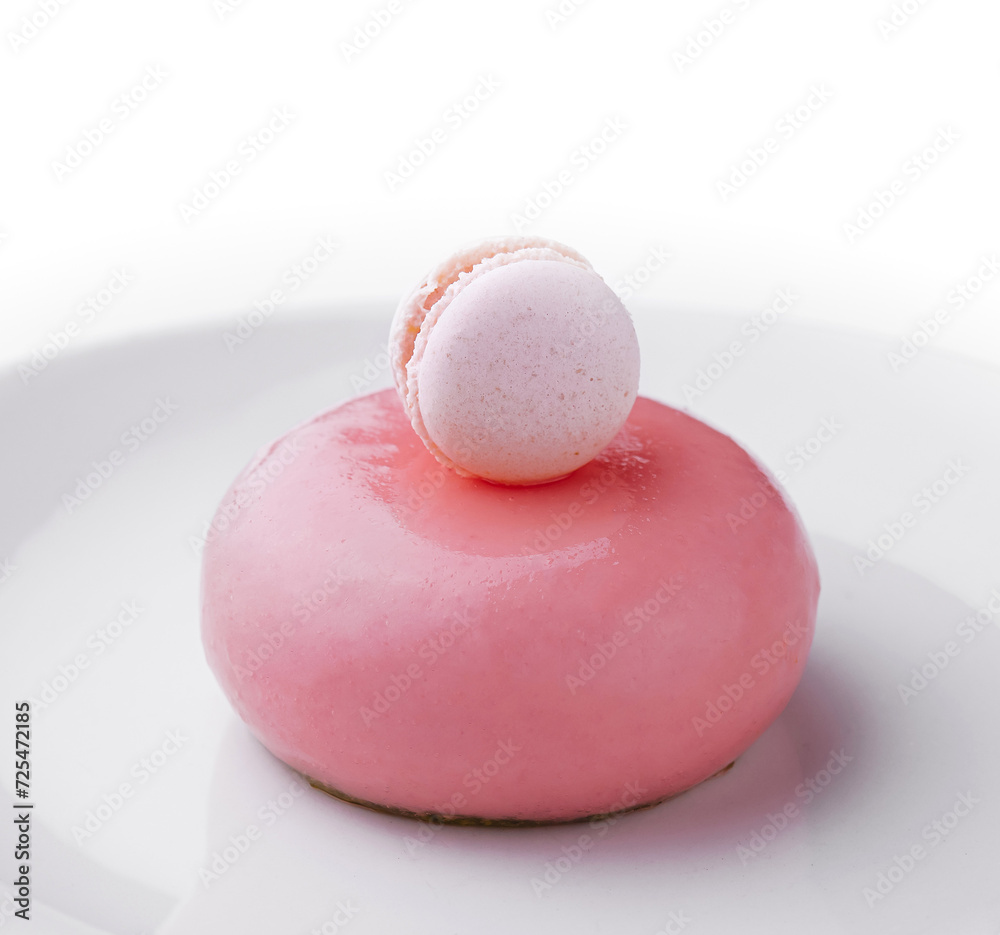 Pink mousse cake decorated with white macaroon Pink mousse cake decorated with white macaroon