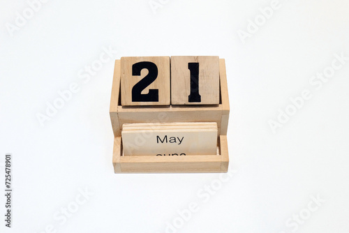 21st of May wooden perpetual calendar. Shot close up isolated on a white background photo