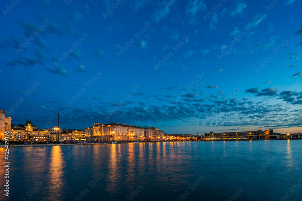 Dusk and night in Trieste. Between historic buildings and the sea. Dusk and night in Trieste. Between historic buildings and the sea.